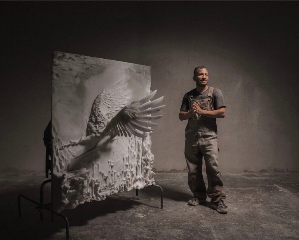 man standing next to Sculpture carved from plasticine and cast in resin